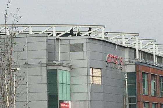 A-snipers-watching-march-from-Manchester-rooftops