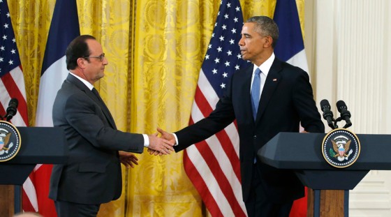 U.S. President Obama greets French President Hollande during joint news conference at the White House in Washington