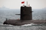 Chinese Navy submarine takes part in an international fleet review to celebrate the 60th anniversary of the founding of the People's Liberation Army Navy in Qingdao